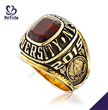 Gold plated university students red stone wedding rings