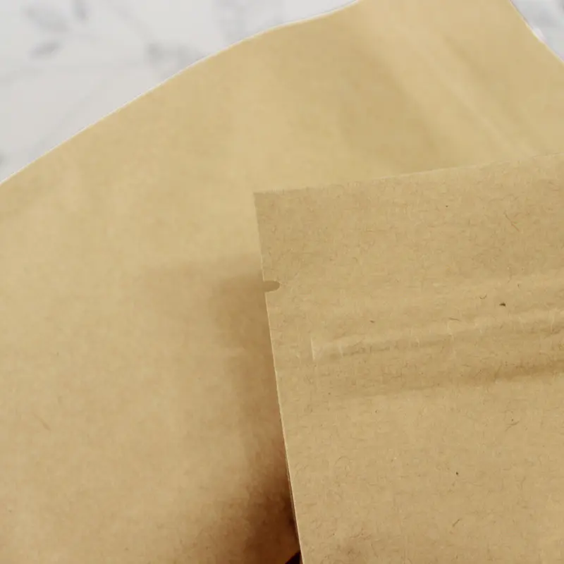 Zipper top plain foil inside flat bottom kraft paper bag with tear notch