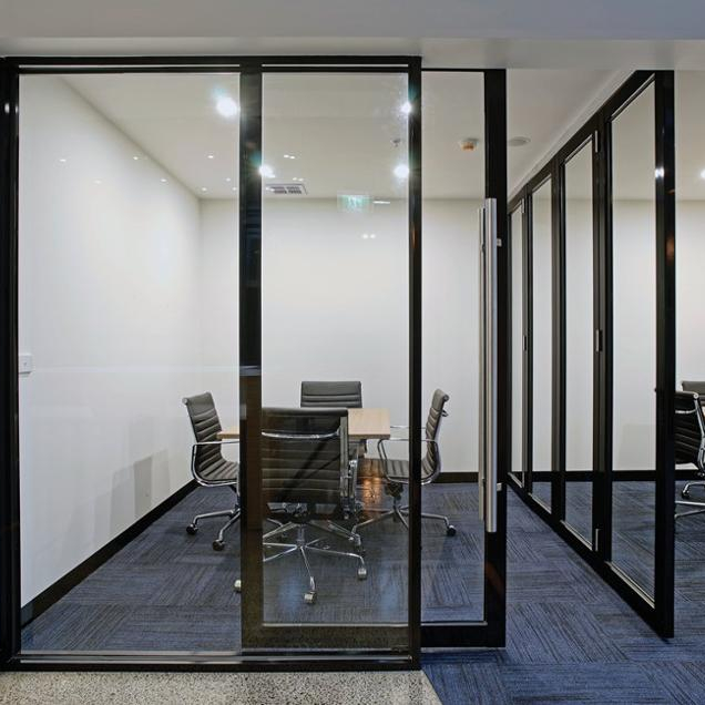 Sliding door operable office partition wall