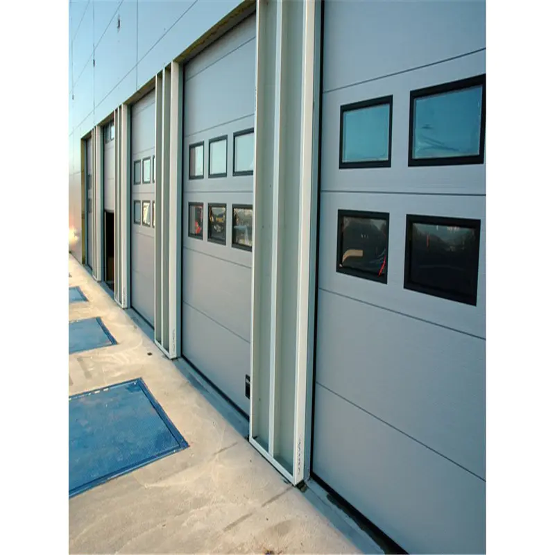 Electric industrialsectional door 129inch*125inch white color with a small door and three view windows