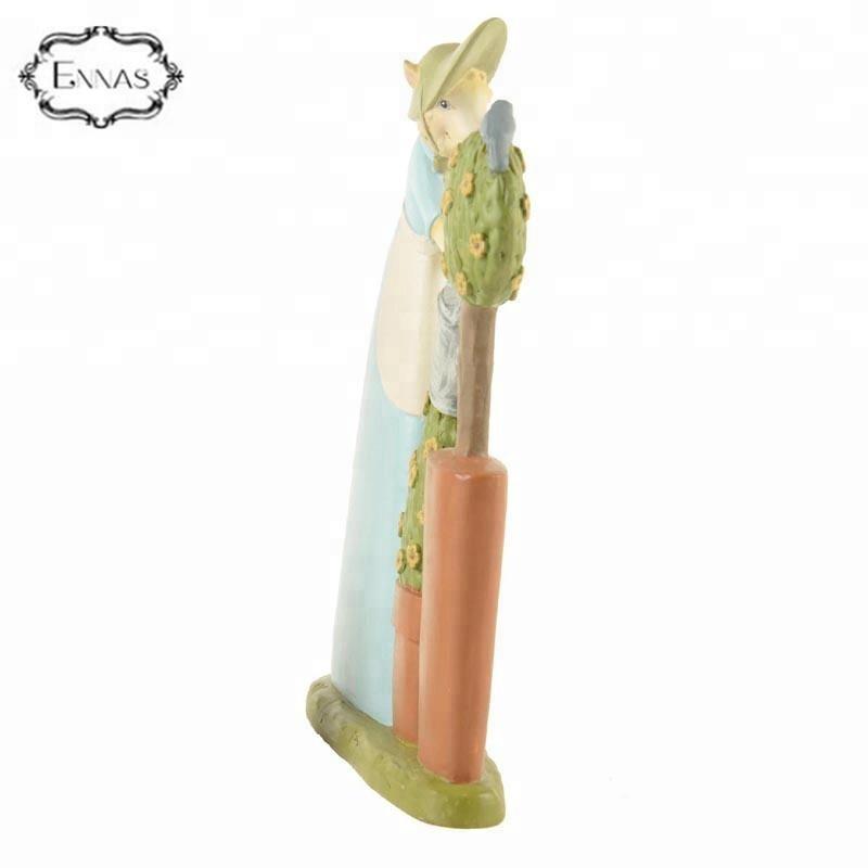 Figurine of a custom-made resin Easter bunny watering tree