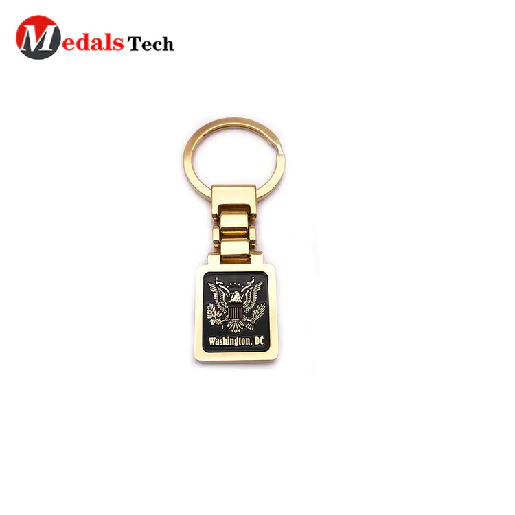 Custom embossed logo shinny gold finish tourist souvenir keychain